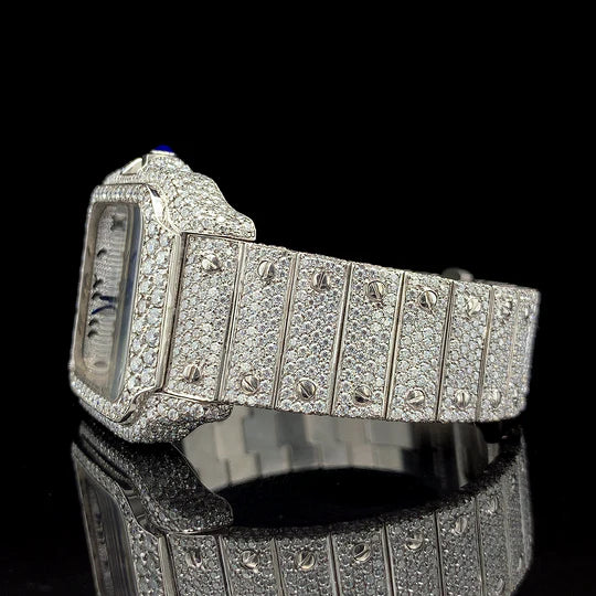 Lux Watches diamond encrusted luxury Cartier watch for sale with blue cabochon crown on black reflective surface