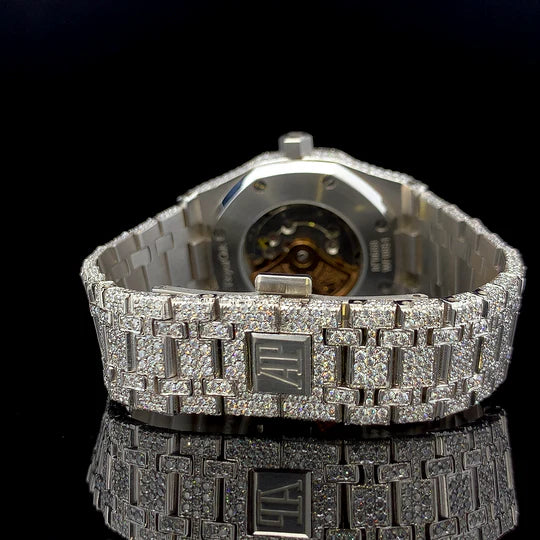 Audemars Piguet diamond dial watch with fully pave diamond bracelet and visible exhibition caseback on black reflection